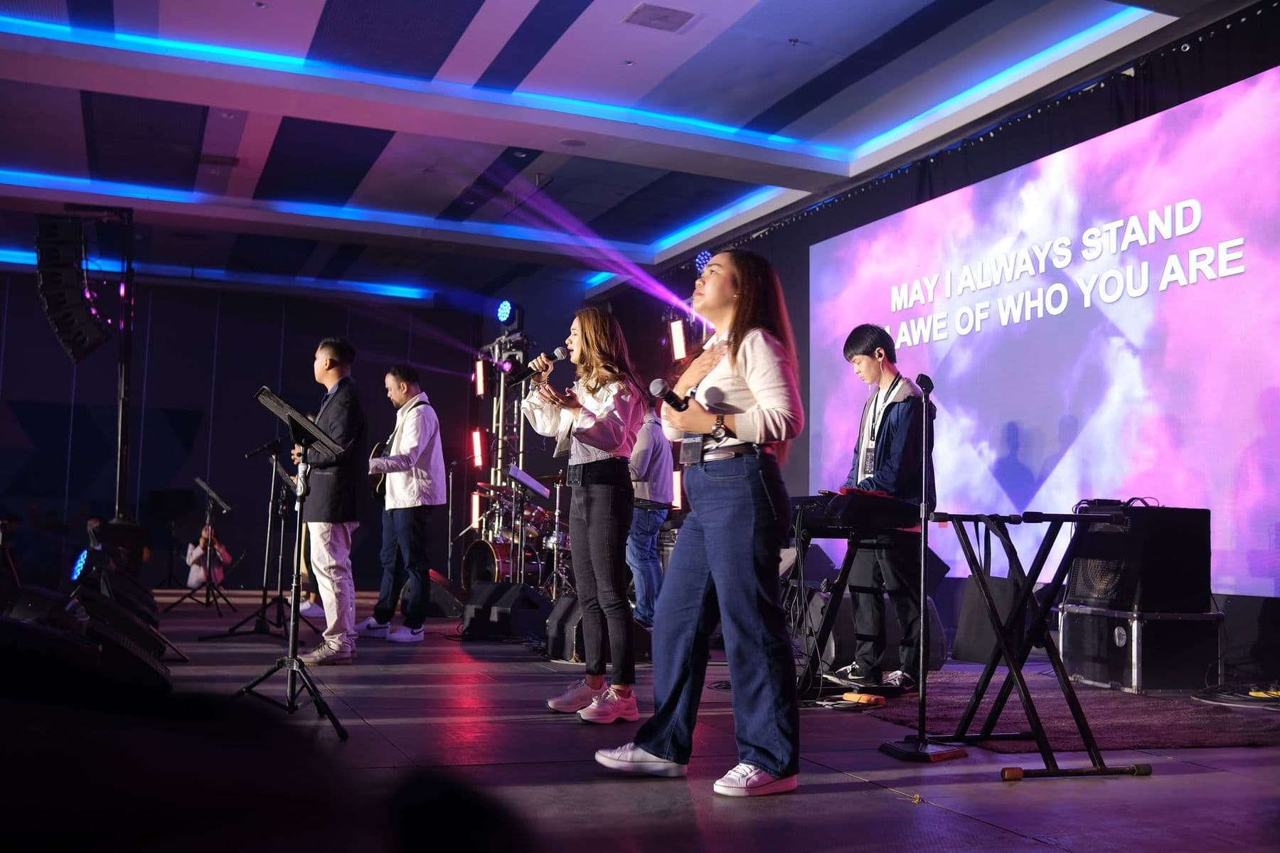 The worship team leading from the stage
